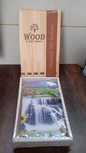 Elegant vertical wooden scenery art with hooks for wall decor.